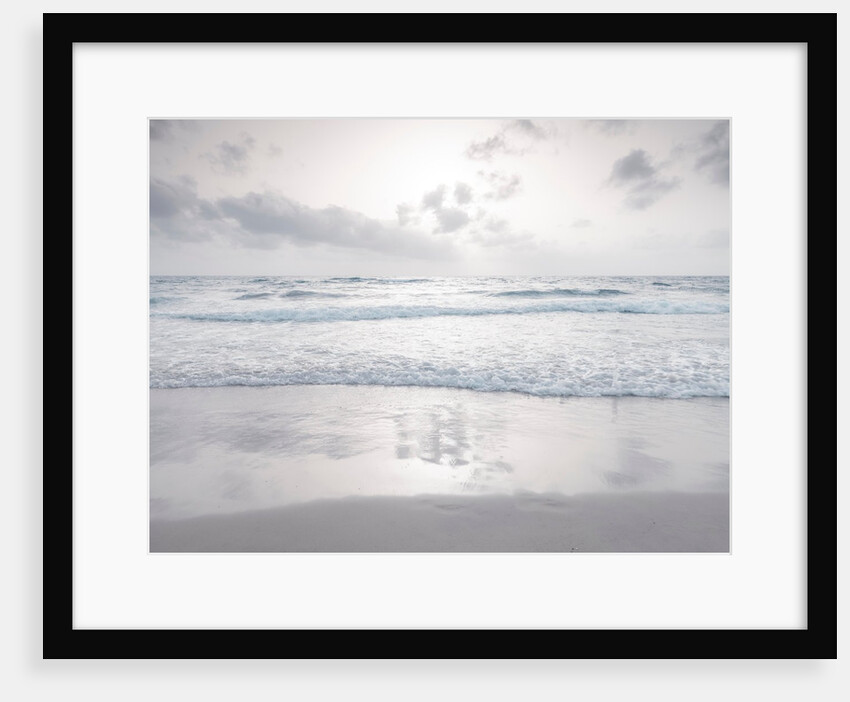 Tranquil beach with cloudscape by Assaf Frank